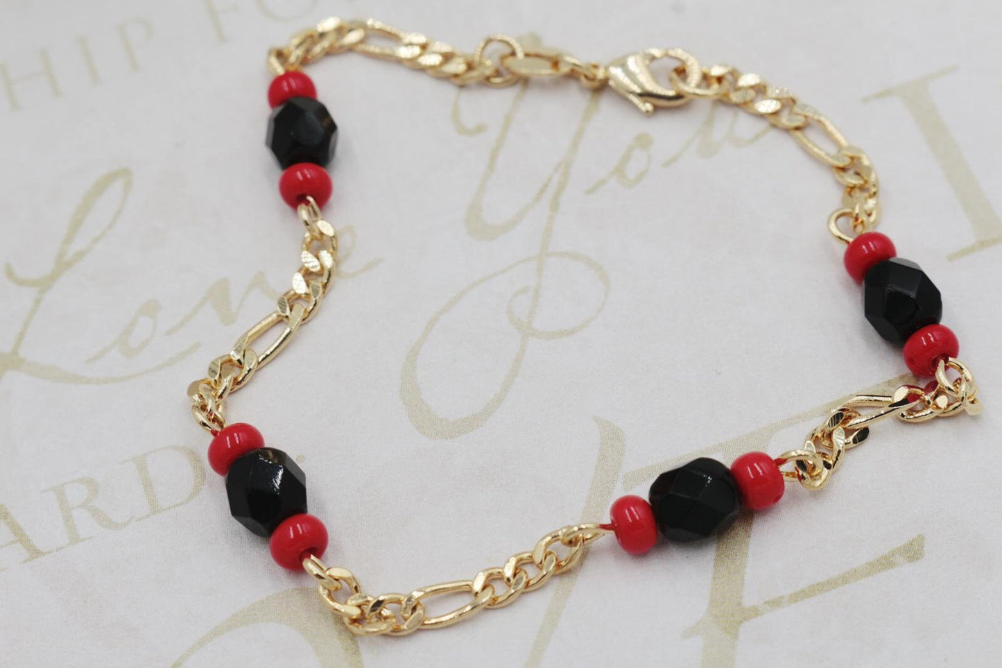 Black and Red Charms Figaro link Bracelet