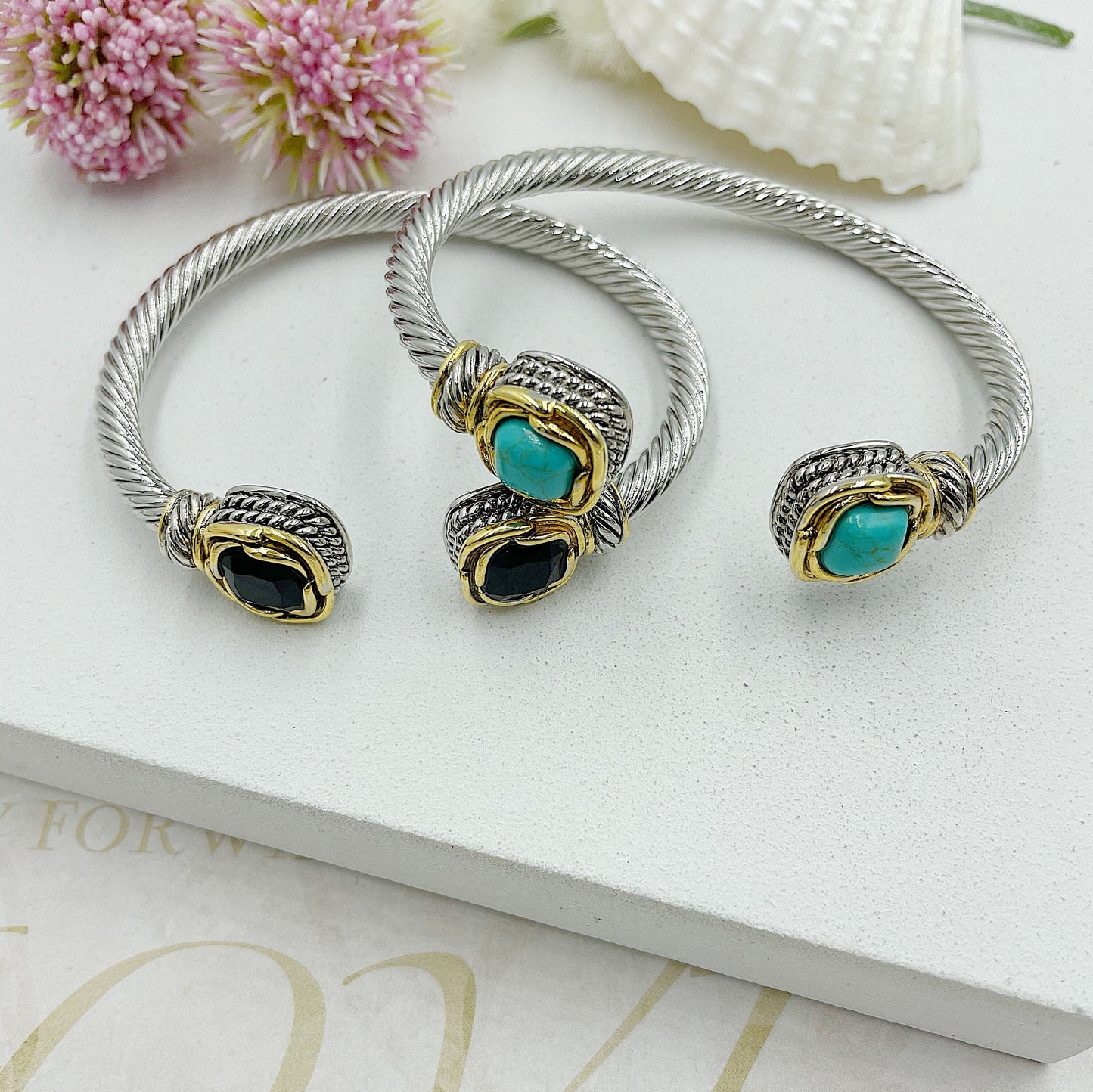 Open Twisted Arch With Stones At The Ends With Gold Accents Bracelet