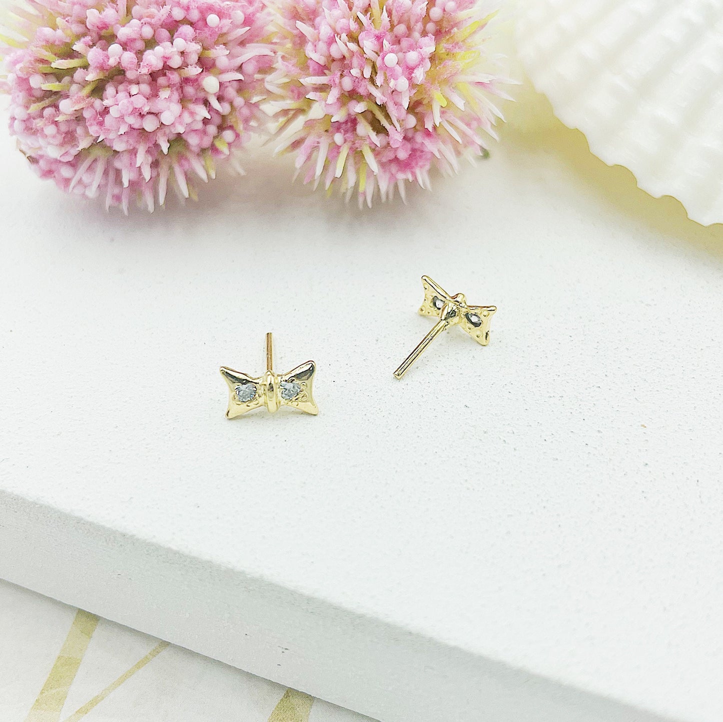 Bow With Two Light Stones Stud Earrings