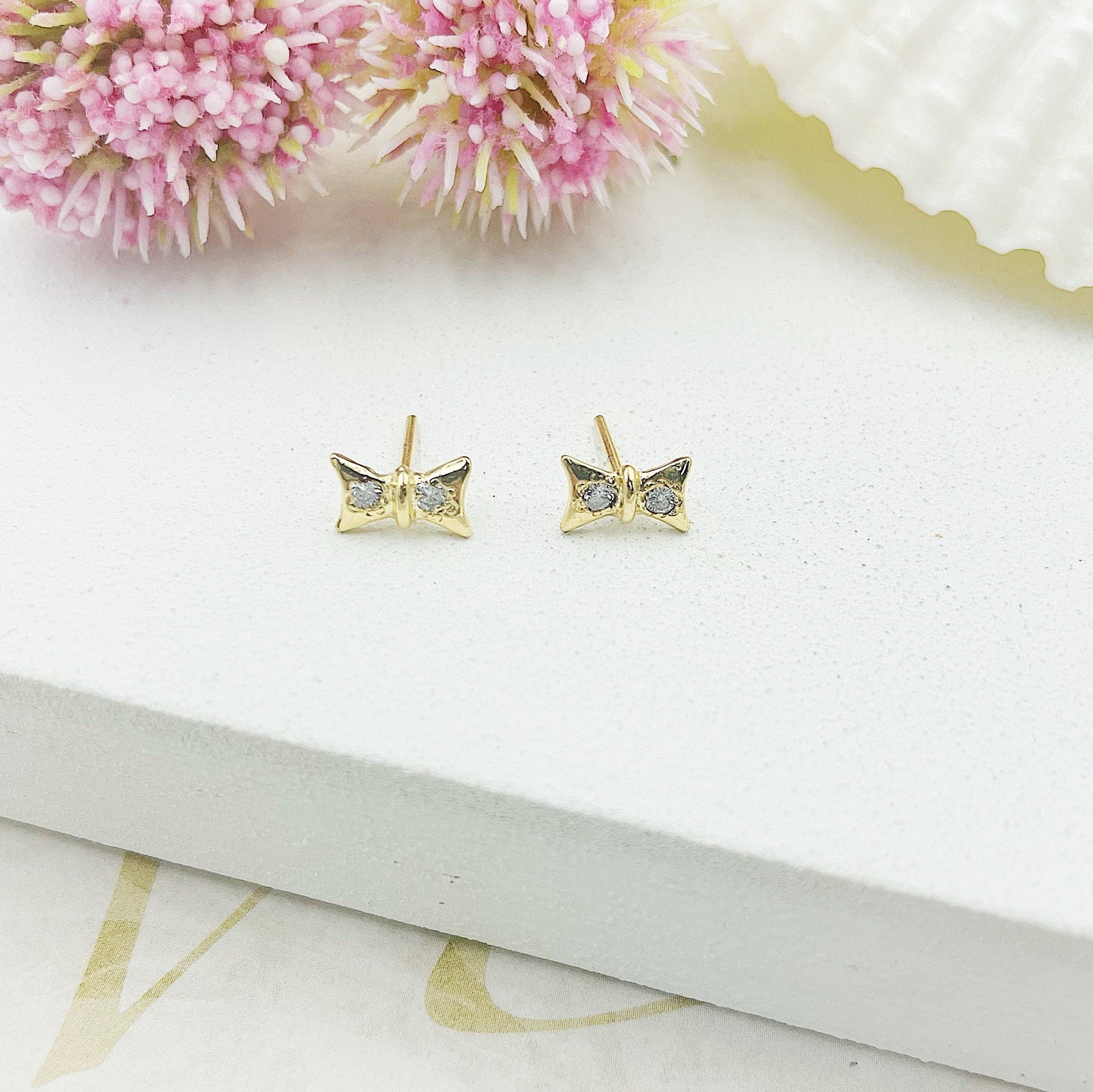 Bow With Two Light Stones Stud Earrings